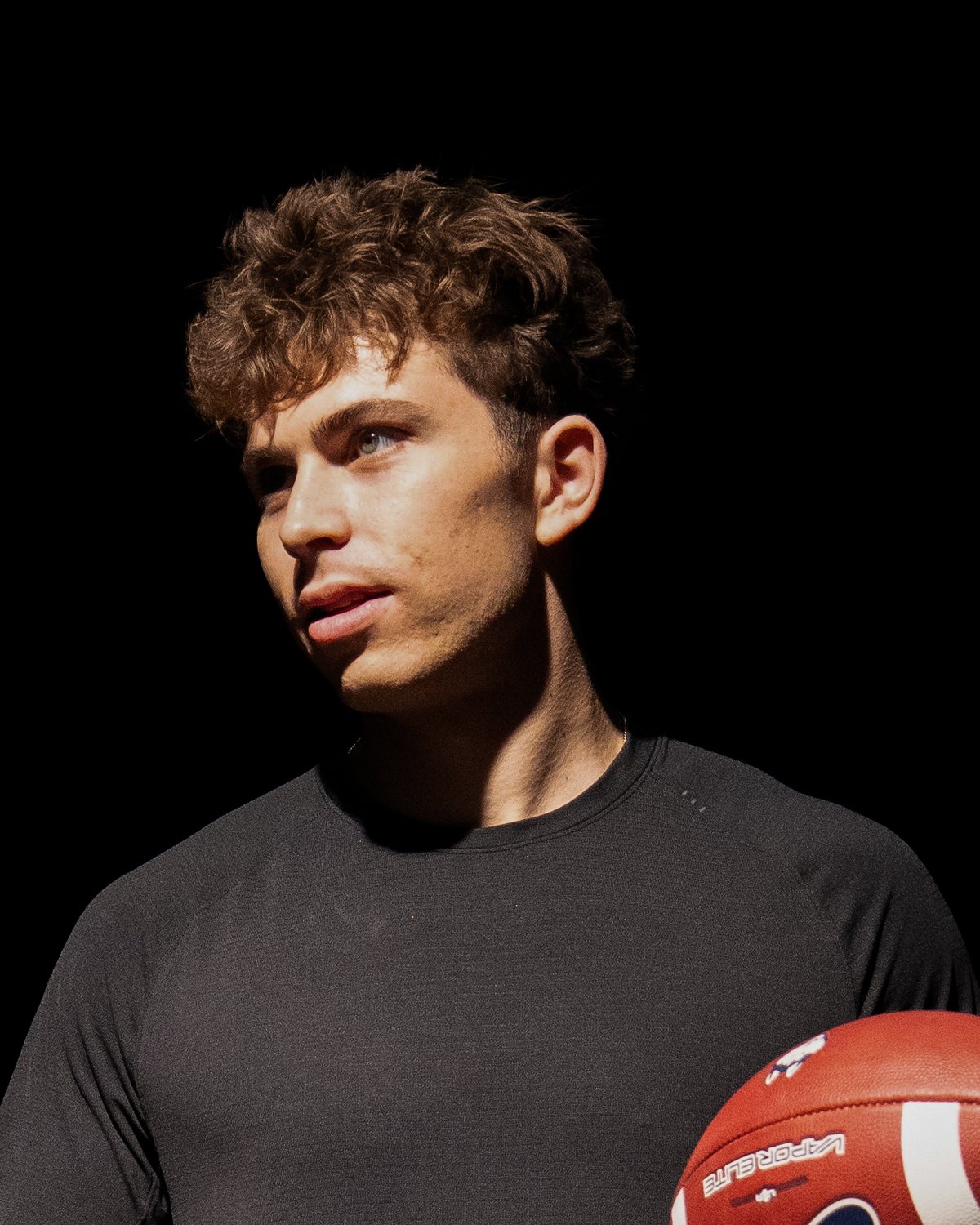 Cooper Soolman holding a football